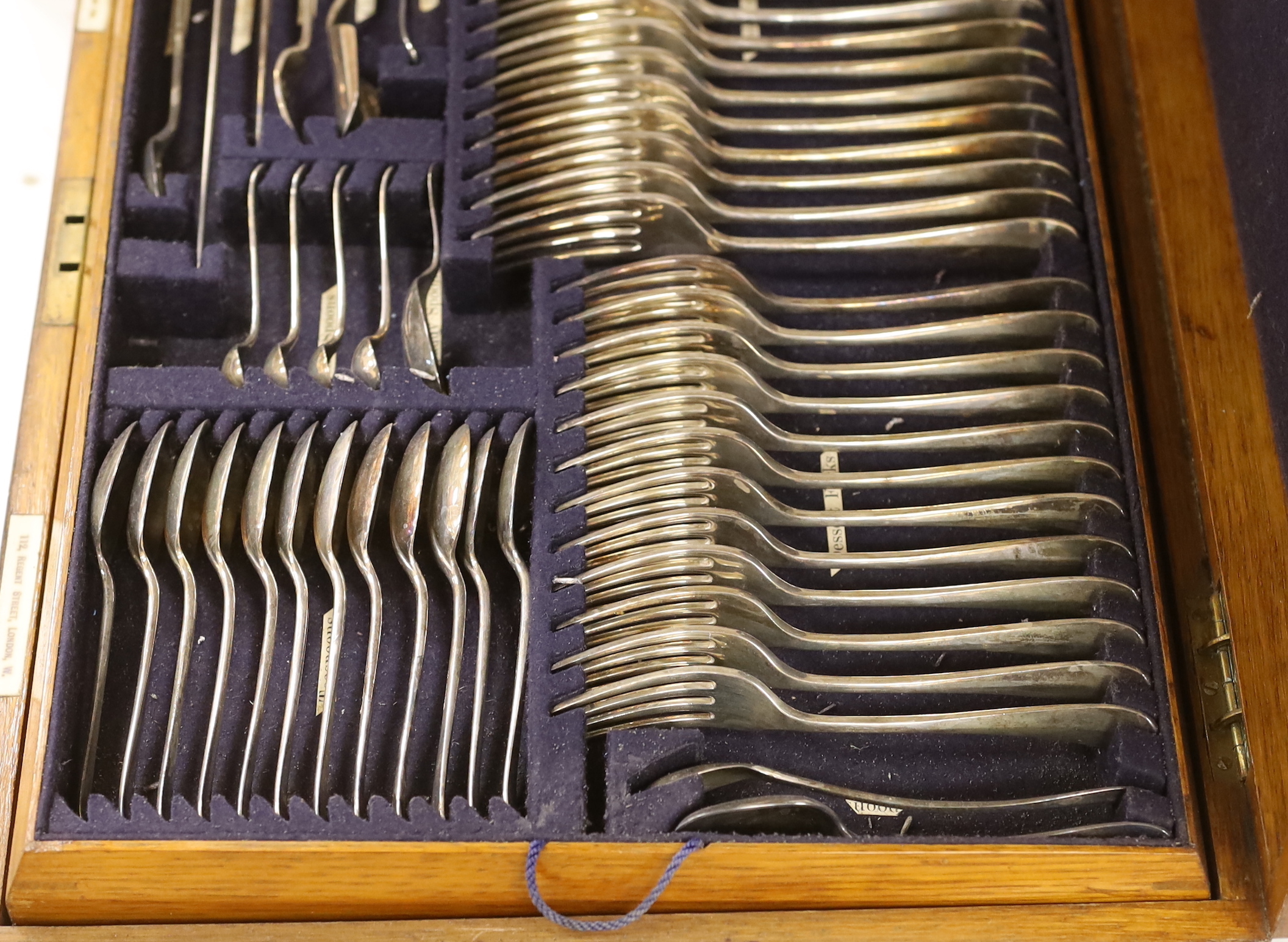 An oak canteen of plated suite of cutlery